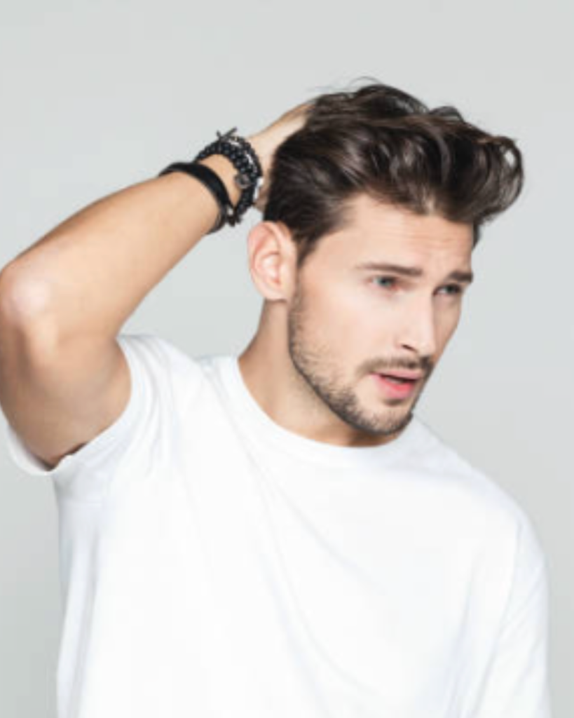 A Man Examining His Hairline Before A Professional Hair Loss Consultation New York To Discuss Thinning And Recession.